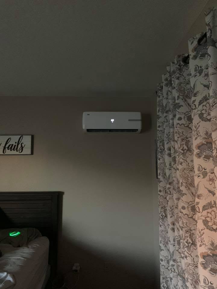Stone AC — wall-mounted indoor air handler installed in bedroom